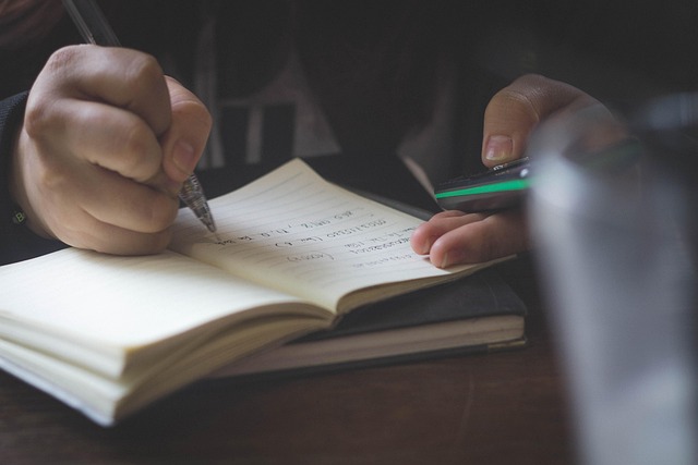 Student studying Arabic script calligraphy